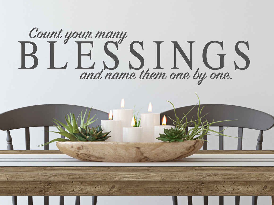 Wall decals for kitchen that say ‘count your many blessings and name them one by one’ on a kitchen wall.