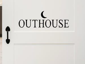 Wall decals for bathroom that say ‘Outhouse' with a moon design on a bathroom door.