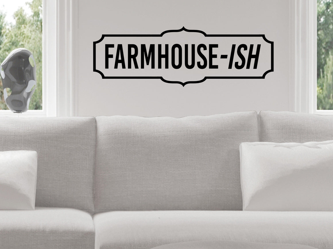 Living room wall decals that say ‘Farmhouse-ish’ with a plaque design on a living room wall. 