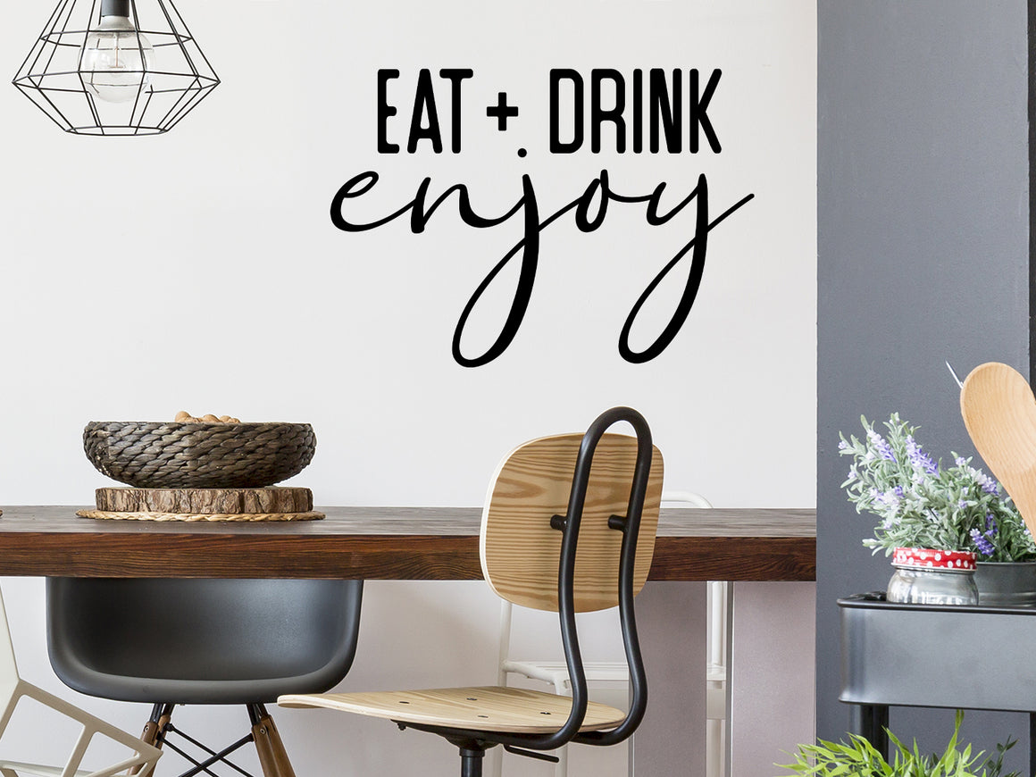 Wall decals for kitchen that say ‘Eat Drink Enjoy’ in a bold font on a kitchen wall.