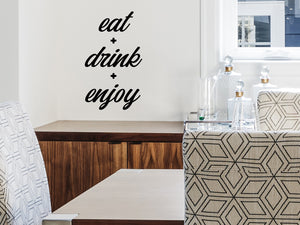 Wall decals for kitchen that say ‘eat drink enjoy’ on a kitchen wall.