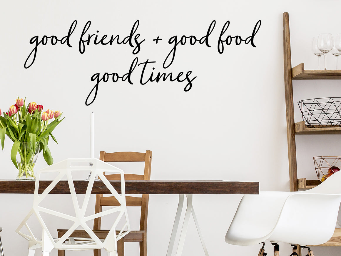 Wall decals for kitchen that say ‘Good Friends Good Food Good Times’ in a cursive font on a kitchen wall.