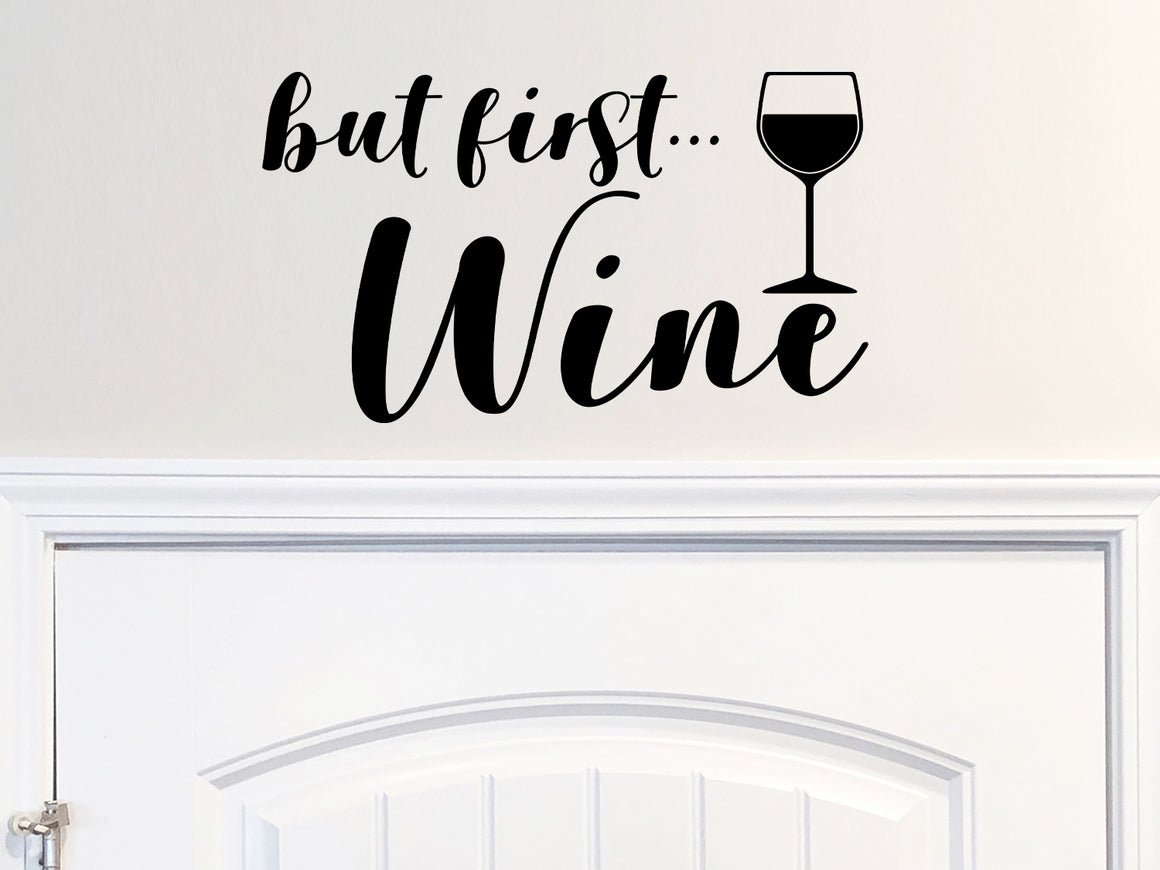Wall decals for kitchen that say ‘but first wine’ on a kitchen wall.