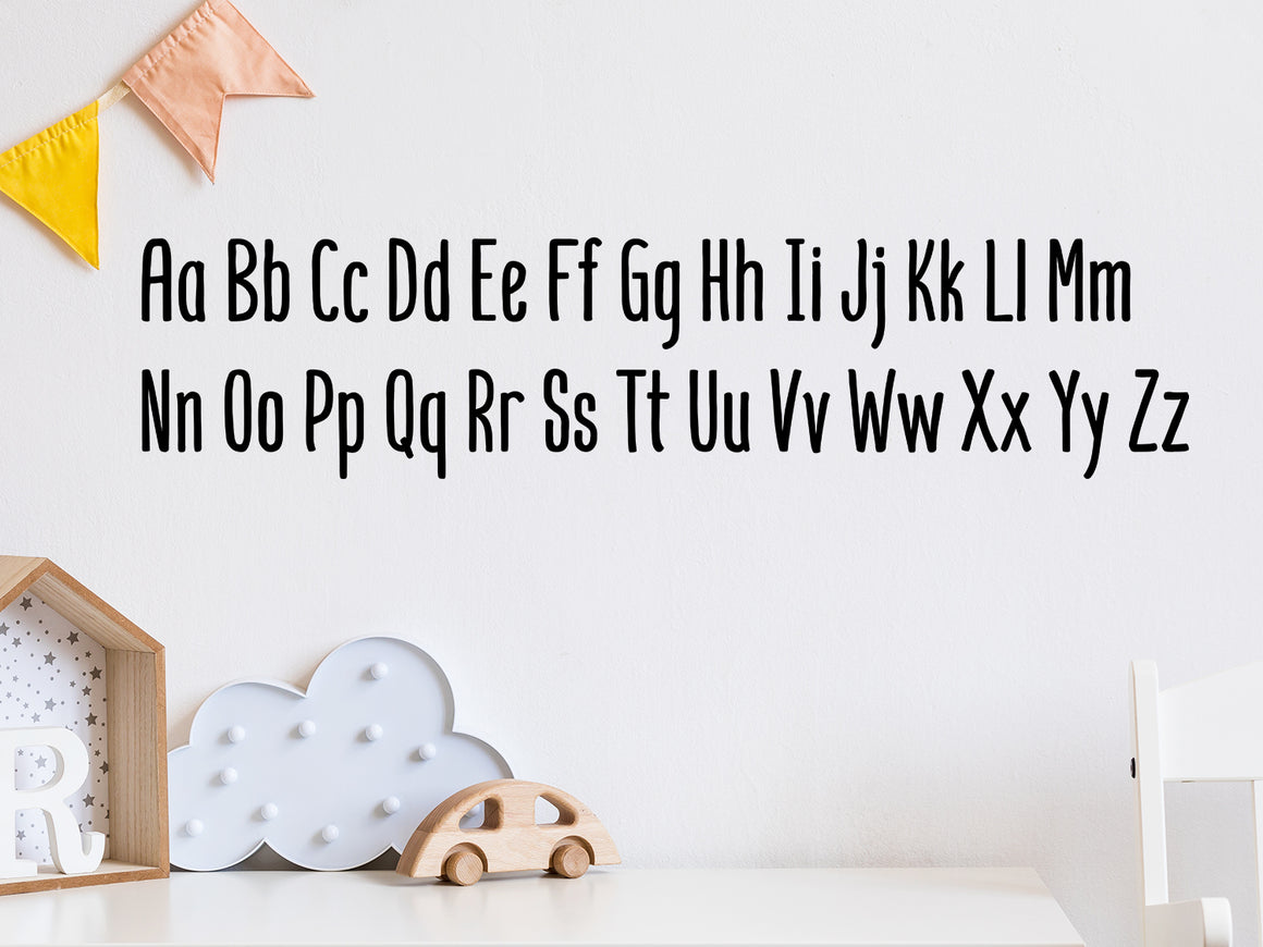 Decorative wall decal that has all the letters of the alphabet on a kid’s room wall. 