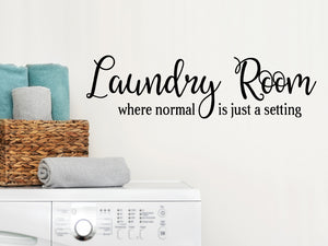Laundry room wall decal that says ‘Laundry Room Where Normal is just a Setting’ in a script font on a laundry room wall