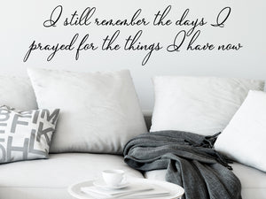 Living room wall decals that say ‘I still remember the days i prayed for the things I have now’ on a living room wall. 