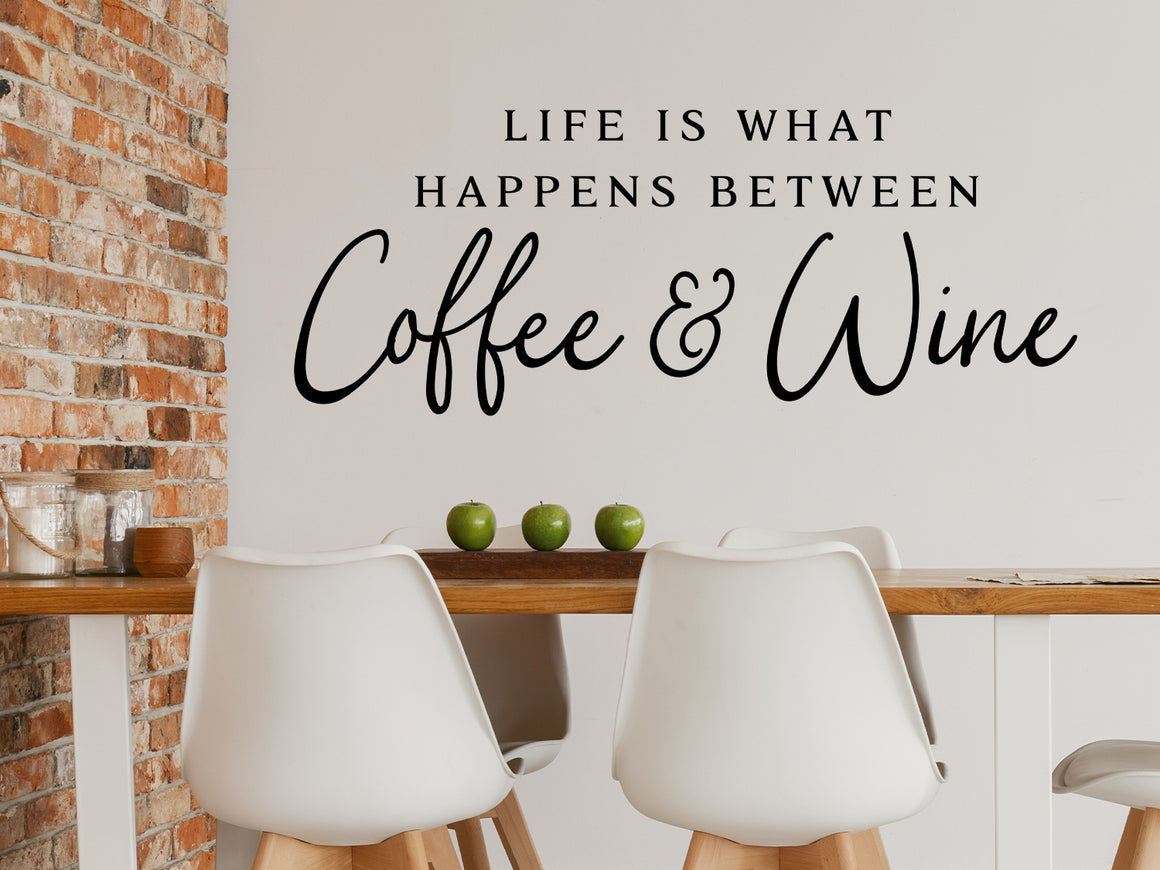 Wall decals for kitchen that say ‘Life Is What Happens Between Coffee And Wine’ on a kitchen wall.