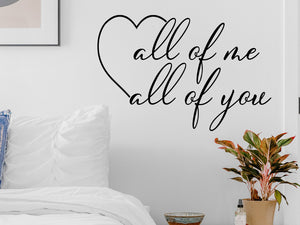 Wall decal for bedroom that says ‘all of me all of you’ on a bedroom wall.