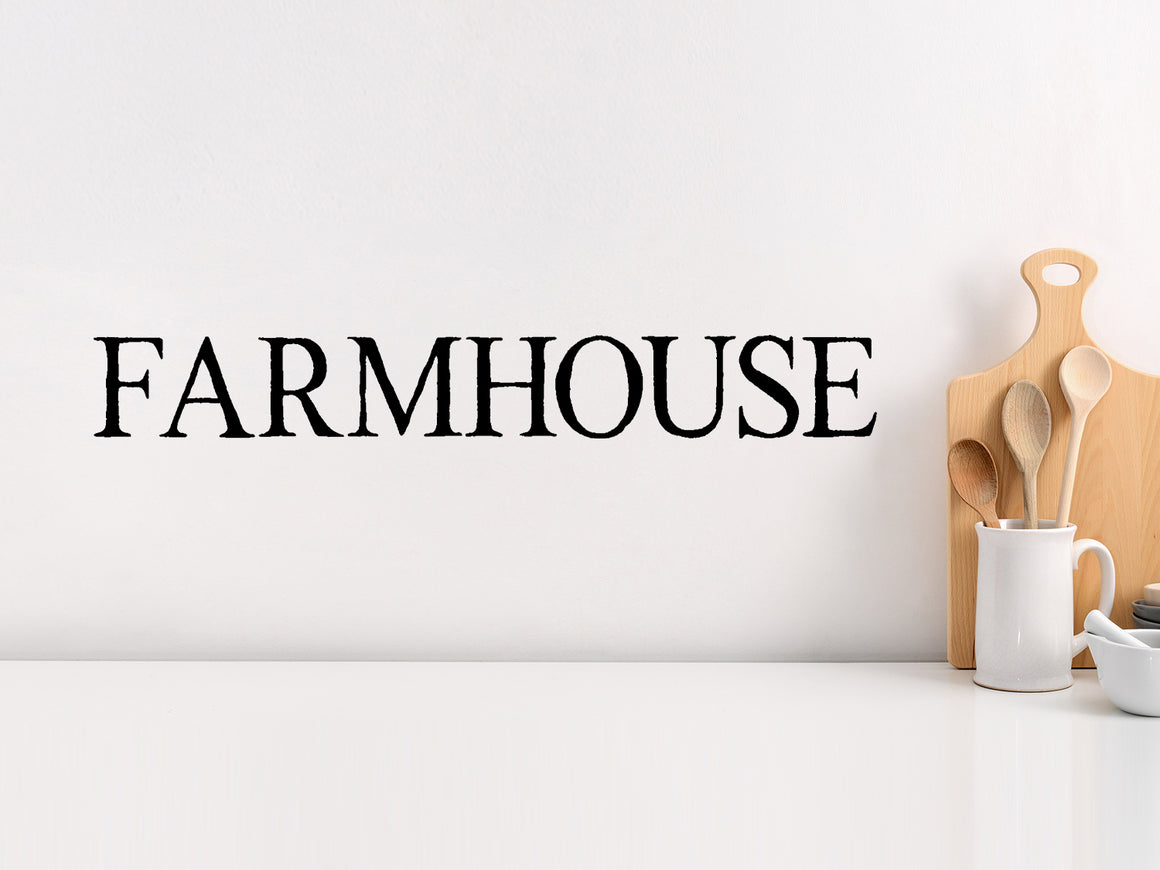 Wall decals for kitchen that say ‘Farmhouse’ in a classic font on a kitchen wall.