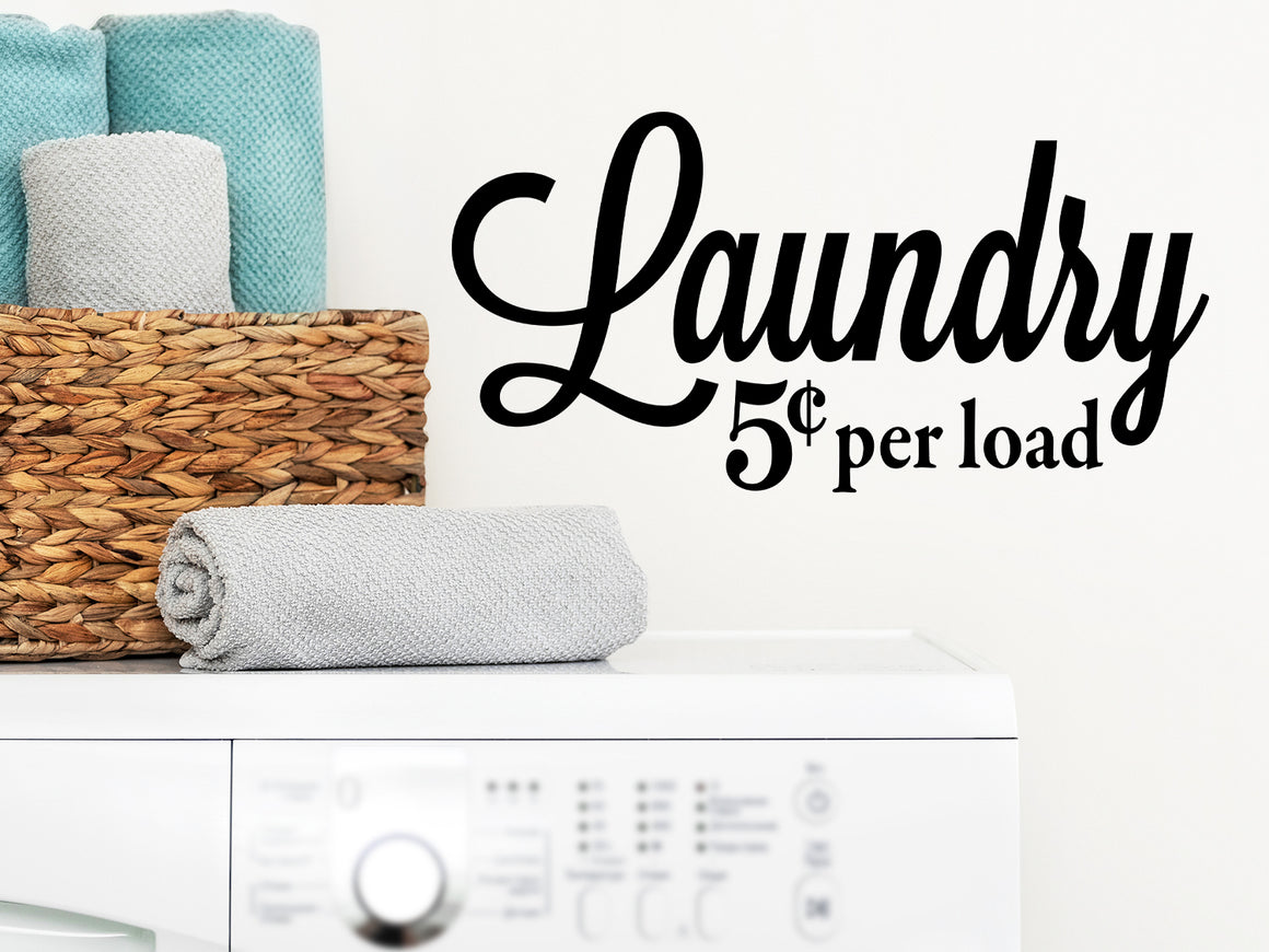 Laundry room wall decal that says ‘Laundry 5 Cents Per Load’ in a cursive font on a laundry room wall