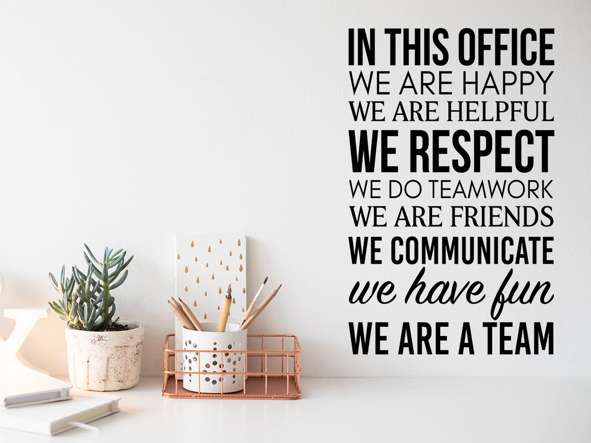 Wall decal for the office that says ‘In This Office We Are A Team’ on an office wall.