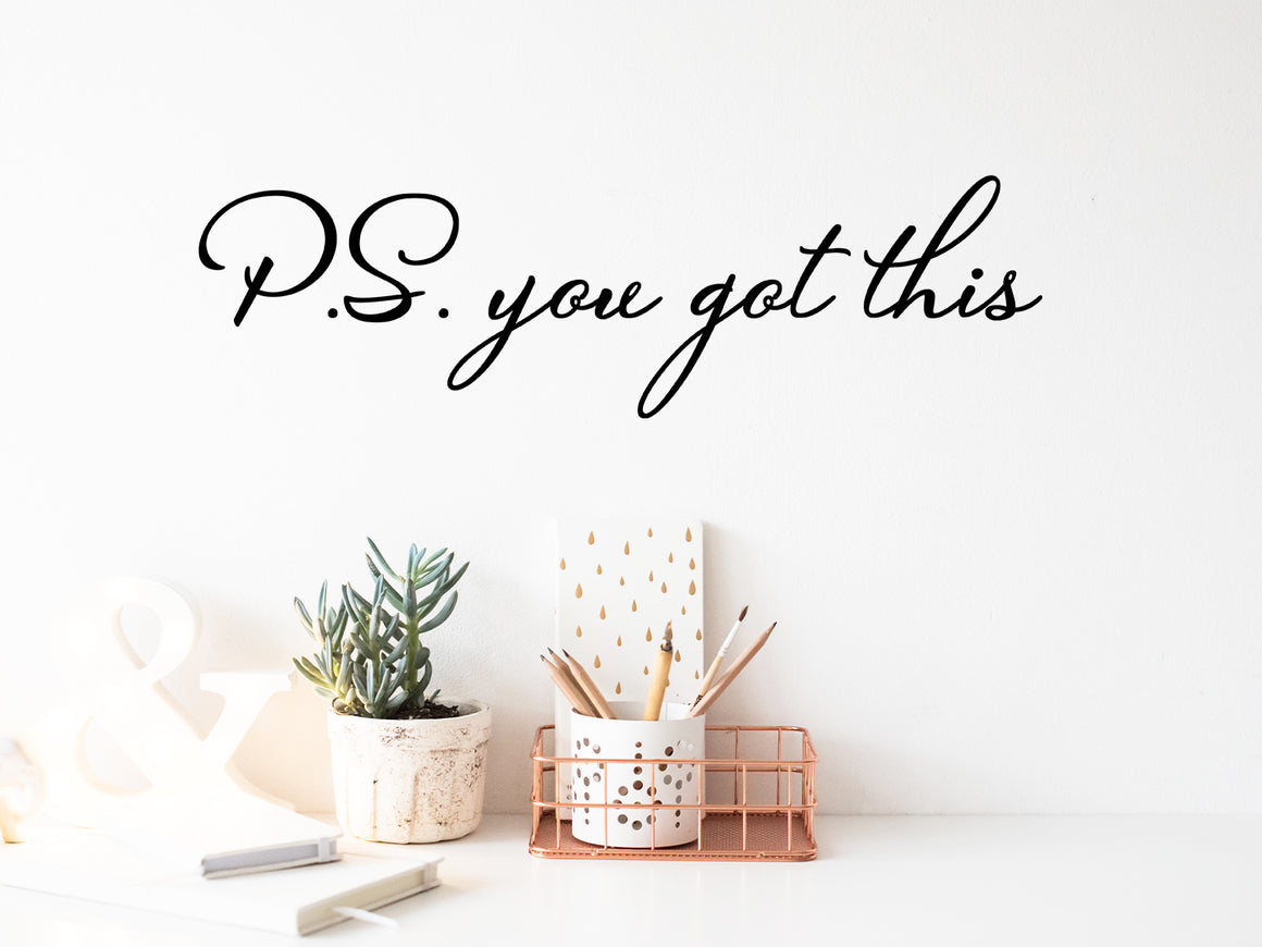 Wall decal for the office that says ‘PS You Got This’ in a cursive font on an office wall.