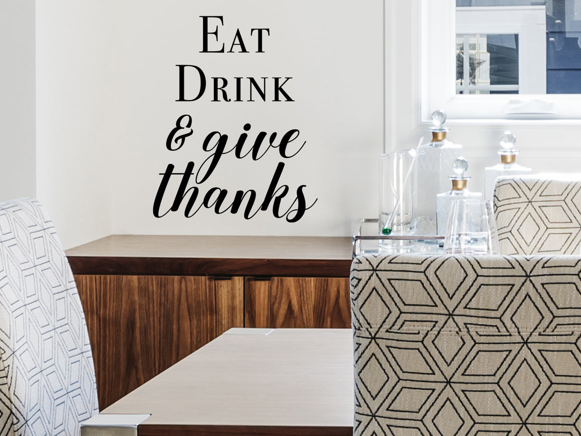 Wall decals for kitchen that say ‘Eat drink & give thanks’ on a kitchen wall.