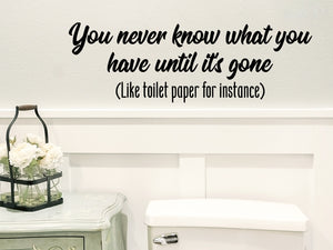 Wall decals for bathroom that say 'You never know what you have until it's gone' on a bathroom wall. 