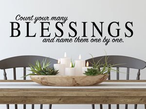 Wall decals for kitchen that say ‘count your many blessings and name them one by one’ on a kitchen wall.