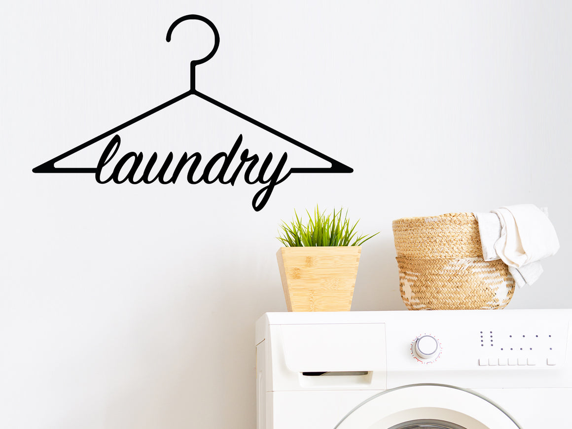 Laundry room wall decal that says ‘Laundry (Clothes Hanger)’ on a laundry room wall.