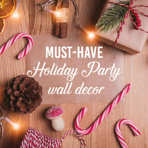 Image of a wooden table with gifts, candy-canes, and words that say, 'Must-Have Holiday Party wall decor.'