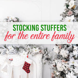 Image of a christmas tree, table, and a stocking with a graphic overlay that says, 'stocking stuffers for the entire family.'