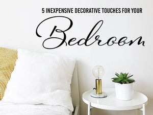 Wall decal for bedroom that says ‘5 inexpensive decorative touches for your bedroom’ on a bedroom wall.