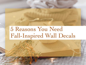 A table decorated with fall decor with a graphic overlay that says, '5 reasons you need fall-inspired wall decals.'