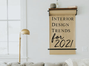 Stick on wall art that says, 'interior design trends for 2021' on a butcher paper roller. 