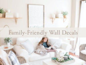 Image of a decorate living room with wall decor and words overlaid that say, 'family-friendly wall decals.'