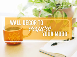 Picture of a table with a coffee cup and a plant with a graphic overlay that says, 'Wall decor to inspire your mood.'