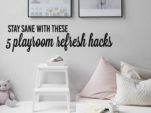 Wall decals for kids that says, 'Stay sane with these 5 playroom refresh hacks' on a kids bedroom wall. 