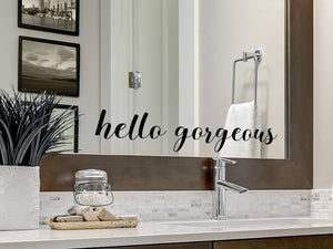 Wall decal for the bathroom mirror that says ‘hello gorgeous’ on a bathroom mirror.