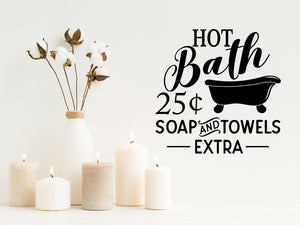 Wall decals for the bathroom that say ‘hot bath 25 cents soap and towels extra'’ on a bathroom wall.