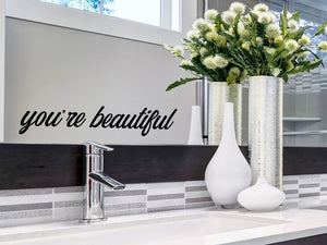 Wall decals for bathroom that say ‘you're beautiful’ on a bathroom wall.