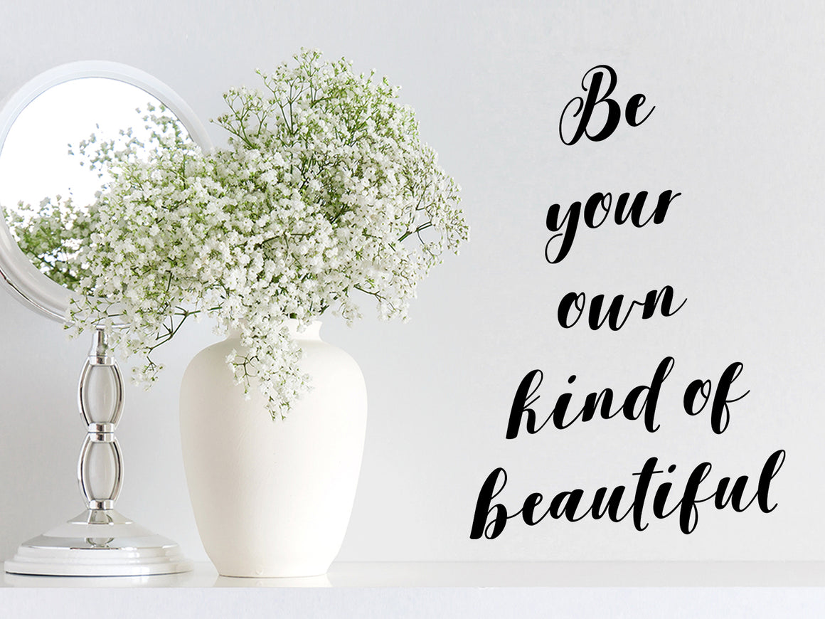 Wall decal for bathroom that says ‘be your own kind of beautiful’ on a bathroom wall.