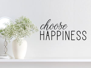 Wall decal for bathroom that says ‘choose happiness’ on a bathroom wall.