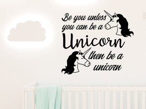 Wall decal for kids in a black color that says ‘Always Be You Unless You Can Be A Unicorn’ on a kid’s room wall. 