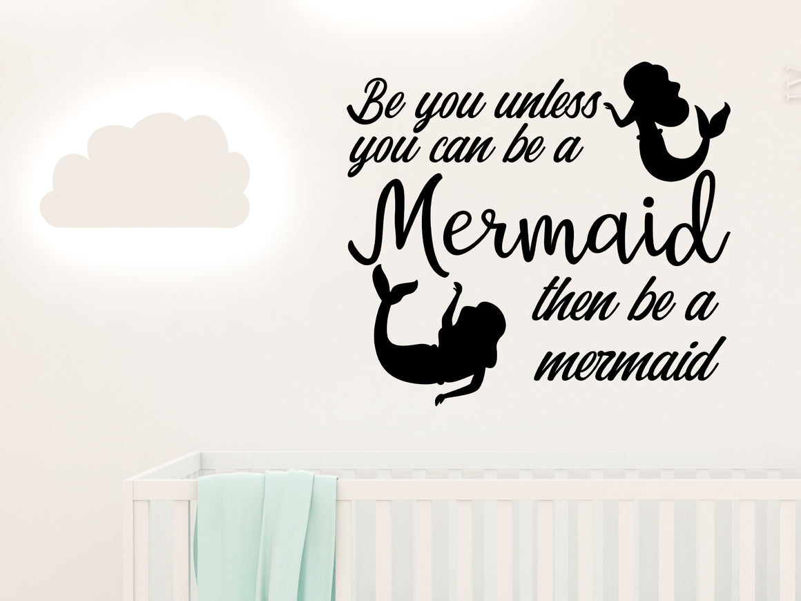Wall decal for kids in a black color that says ‘Always Be You Unless You Can Be A Mermaid’ on a kid’s room wall. 