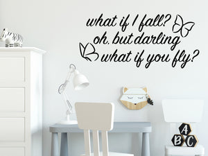 Wall decal for kids in a black color that says ‘What If I Fall, Oh But My Darling, What If You Fly?’ in a cursive font on a kid’s room wall. 
