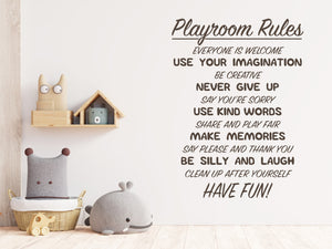 Living room wall decals that say ‘Playroom Rules’ in brown on a living room wall. 