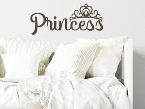 Wall decal for kids in brown that says ‘Princess’ in a script font on a kid’s room wall. 