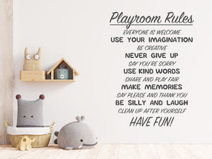 Living room wall decals that say ‘Playroom Rules’ in grey on a living room wall. 