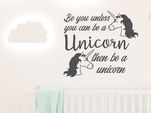 Wall decal for kids in a grey color that says ‘Always Be You Unless You Can Be A Unicorn’ on a kid’s room wall. 