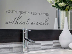 You're Never Fully Dressed Without A Smile Cursive | Bathroom Mirror Decal