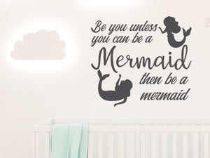 Wall decal for kids in a grey color that says ‘Always Be You Unless You Can Be A Mermaid’ on a kid’s room wall. 