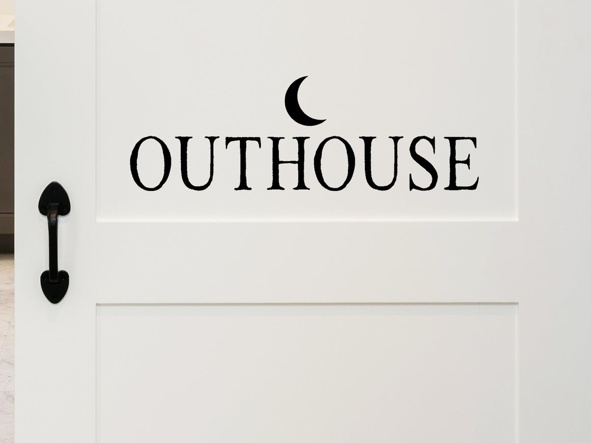 Wall decals for bathroom that say ‘Outhouse' with a moon design on a bathroom door.