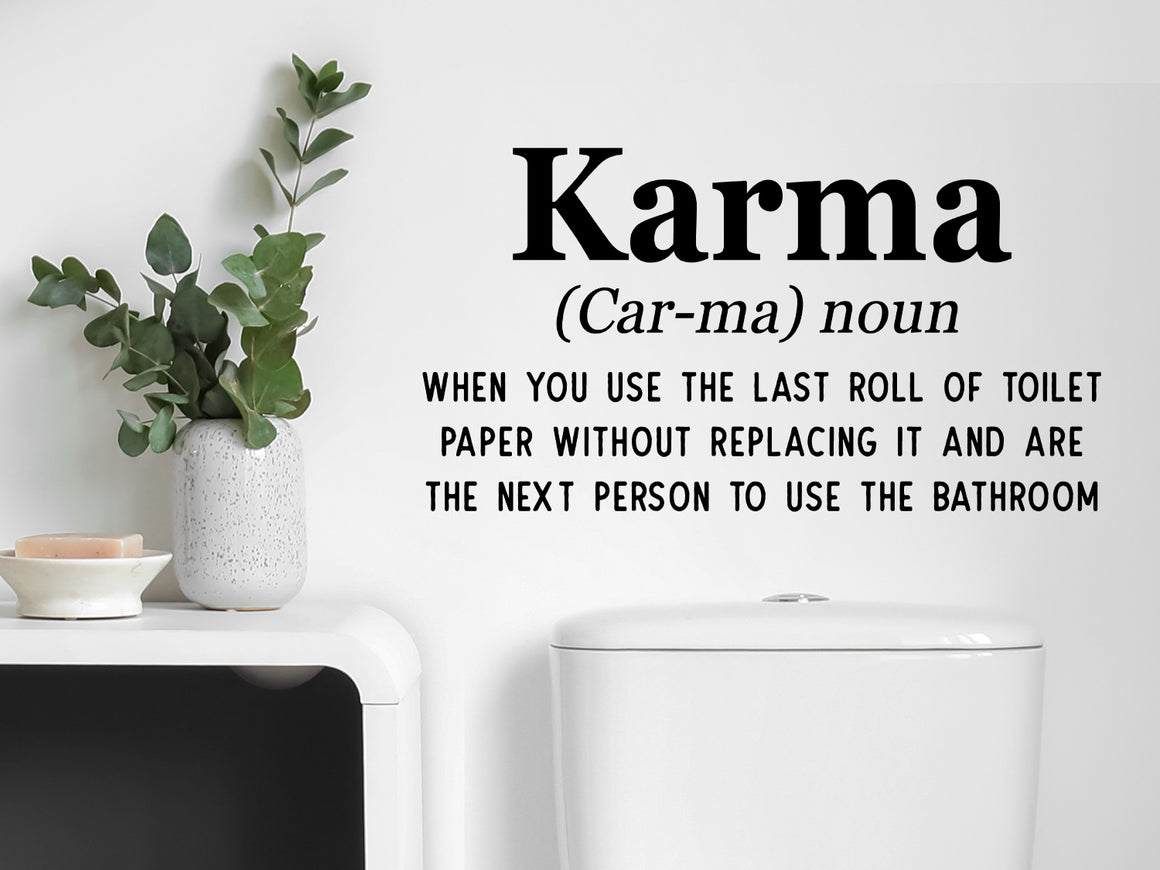 Wall decals for bathroom that say ‘Karma, when you use the last roll of toilet paper without replacing it and are the next person to use the bathroom’ on a bathroom wall.