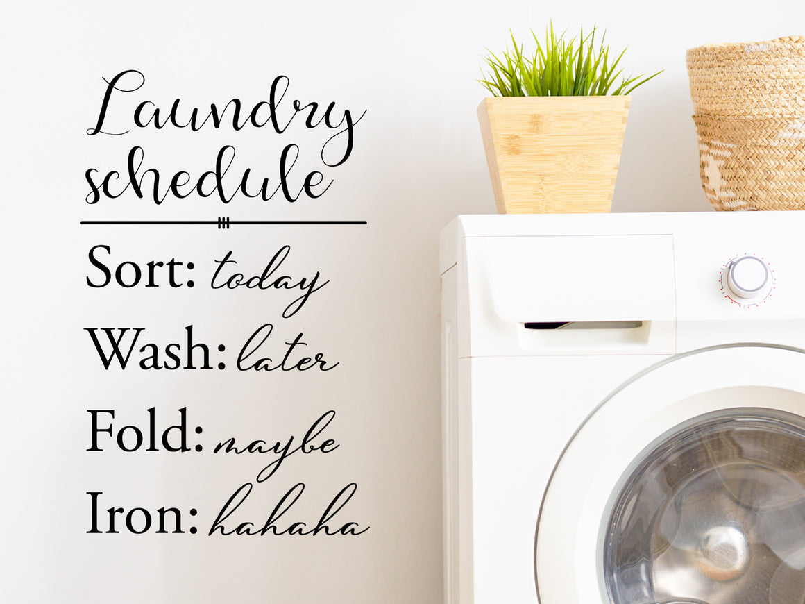 Laundry room wall decal that says ‘Laundry Schedule Sort: Today Wash: Later Fold: Maybe Iron: Hahaha’ on a laundry room wall.