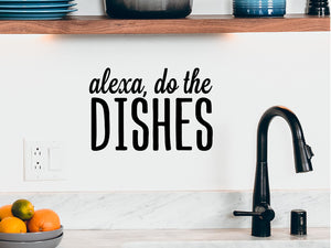 Wall decals for kitchen that say ‘Alexa Do The Dishes’ in a bold font on a kitchen wall.