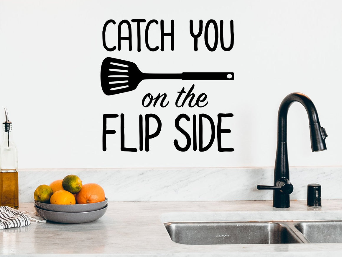 Wall decals for kitchen that say ‘catch you on the flip side’ on a kitchen wall.