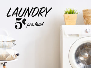 Laundry room wall decal that says ‘Laundry 5 Cents Per Load’ on a laundry room wall