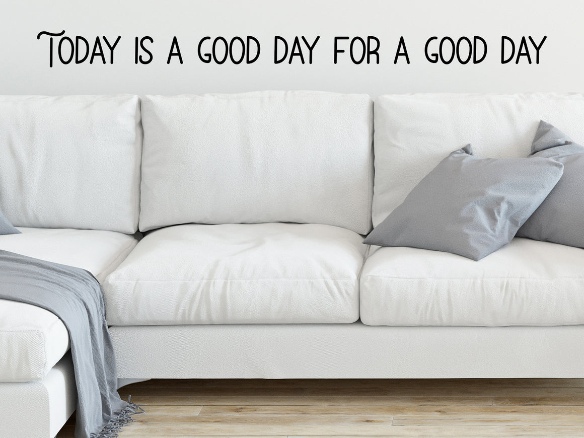 Living room wall decals that say ‘today is a good day for a good day’ on a living room wall. 