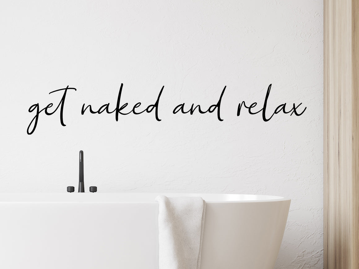 Wall decals for bathroom that say ‘Get Naked and Relax’ in a script font on a bathroom wall.